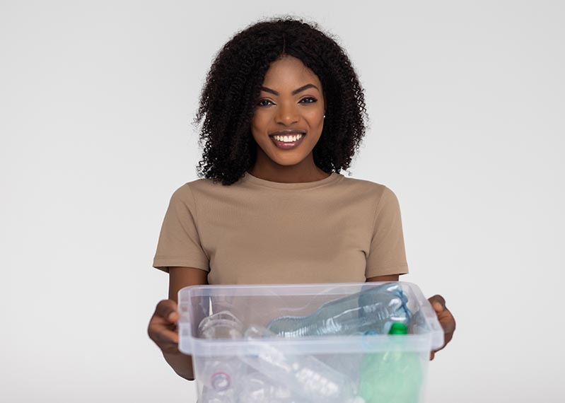 Woman with box of recycling