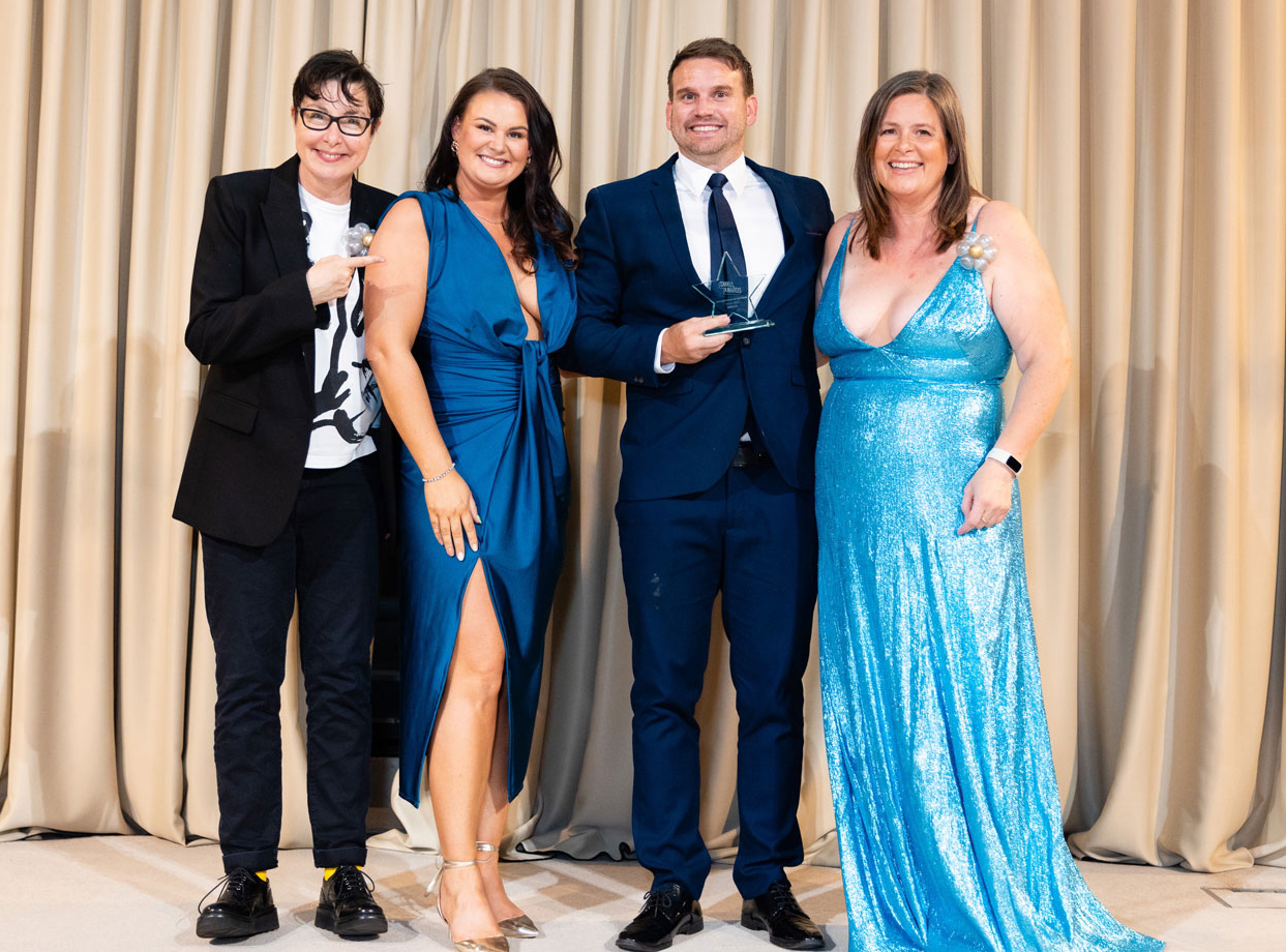 HONA co-founders Charlotte and Michael Henson accept the 2025 Small Business of the Year Award from Sue Perkins and Michelle Ovens CBE at The Small Awards.